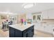 Stylish kitchen featuring an island with white countertops, stainless steel appliances and a dining area at 602 Stephens Rd, Ruskin, FL 33570