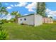 Outbuilding with white siding and a green lawn at 602 Stephens Rd, Ruskin, FL 33570