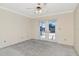 Bedroom featuring carpeting and French doors leading to a patio or outdoor space at 6056 Fall River Dr, New Port Richey, FL 34655
