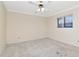 Bedroom featuring neutral walls, ceiling fan and a window with natural light at 6056 Fall River Dr, New Port Richey, FL 34655