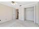 Light and airy bedroom with a ceiling fan, closet and neutral carpeting at 6056 Fall River Dr, New Port Richey, FL 34655