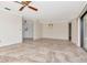 Spacious living room boasts neutral walls, tile flooring and plenty of natural light at 6056 Fall River Dr, New Port Richey, FL 34655