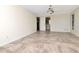 Large main bedroom with tile floors, neutral walls, ceiling fan, and ensuite bathroom access at 6056 Fall River Dr, New Port Richey, FL 34655