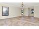 The main bedroom has tile floors, neutral walls, and ample space, and a ceiling fan at 6056 Fall River Dr, New Port Richey, FL 34655