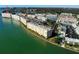 Panoramic aerial view of a waterfront property showcasing multiple residences and lush greenery at 6060 Shore S Blvd # 200, Gulfport, FL 33707