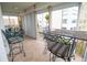 Inviting enclosed patio with a table, chairs, and partial views at 6060 Shore S Blvd # 200, Gulfport, FL 33707