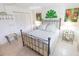 Bright bedroom featuring a queen bed, white closet, and tile flooring at 6060 Shore S Blvd # 200, Gulfport, FL 33707