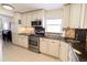 Bright kitchen with granite countertops and stainless steel oven and microwave at 6060 Shore S Blvd # 200, Gulfport, FL 33707