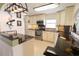 Beautiful kitchen with granite countertops, tiled backsplash, and modern stainless steel appliances at 6060 Shore S Blvd # 200, Gulfport, FL 33707