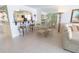 Inviting living area with adjacent dining, bar seating, and tile floors at 6060 Shore S Blvd # 200, Gulfport, FL 33707