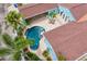Aerial view of the pool, patio and outdoor dining area with chairs and tables at 636 16Th Ne Ave, St Petersburg, FL 33704