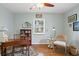 Well lit bedroom with hardwood floors, ceiling fan, desk, and large window for natural light at 636 16Th Ne Ave, St Petersburg, FL 33704