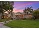 Charming home with a well-maintained lawn, complemented by mature trees and lush landscaping at 636 16Th Ne Ave, St Petersburg, FL 33704