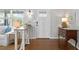 Inviting foyer featuring hardwood floors, stylish console tables, and a well-lit entry at 636 16Th Ne Ave, St Petersburg, FL 33704