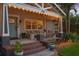 Inviting front porch with string lights, outdoor seating, and well-manicured landscaping at 636 16Th Ne Ave, St Petersburg, FL 33704