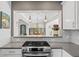Kitchen with a view of the living and dining rooms through a cut out. Stainless appliances at 636 16Th Ne Ave, St Petersburg, FL 33704