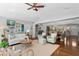 Open-concept living room with stylish furniture and easy flow to the dining area at 636 16Th Ne Ave, St Petersburg, FL 33704