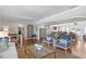 Open concept floorplan showing hardwood floors, open arches and connecting living and dining spaces at 636 16Th Ne Ave, St Petersburg, FL 33704