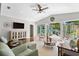 Bright living room with hardwood floors and view of the outdoor pool and patio at 636 16Th Ne Ave, St Petersburg, FL 33704