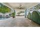 Backyard pool and covered patio with view to garage at 636 16Th Ne Ave, St Petersburg, FL 33704