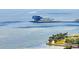 Scenic waterfront view showcasing a modern pier structure, palm trees, and boats on the water at 636 16Th Ne Ave, St Petersburg, FL 33704