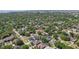 Expansive aerial view showcases a neighborhood with tree-lined streets and diverse home styles at 714 S Lois Ave, Tampa, FL 33609