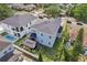 Aerial view of a home showing the gazebo, backyard, nearby properties, and neighborhood at 714 S Lois Ave, Tampa, FL 33609