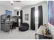 Comfortable bedroom featuring a loft bed, and a cozy beanbag chair at 714 S Lois Ave, Tampa, FL 33609
