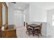 Bright hallway featuring sleek floors, a wooden table and chairs, and modern recessed lighting at 714 S Lois Ave, Tampa, FL 33609