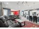 Spacious living room with open kitchen, ample seating, and a marble-topped table on a decorative rug at 714 S Lois Ave, Tampa, FL 33609