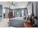 Relaxing main bedroom with carpet, elegant four-poster bed, and classic furnishings at 714 S Lois Ave, Tampa, FL 33609