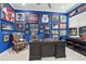Home office showcasing a desk, chair, and wall decorations in room with blue walls and light flooring at 714 S Lois Ave, Tampa, FL 33609