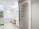 Bathroom features a glass shower, soaking tub, and a double sink vanity at 9308 Fairway Lakes Ct, Tampa, FL 33647