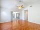 Open bedroom with hardwood floors and sliding glass doors to outdoor space enhancing its appeal at 9308 Fairway Lakes Ct, Tampa, FL 33647