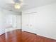 Bright bedroom with hardwood floors and a ceiling fan at 9308 Fairway Lakes Ct, Tampa, FL 33647