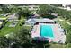 A community pool with a playground and a clubhouse create an inviting place to socialize and relax at 9308 Fairway Lakes Ct, Tampa, FL 33647