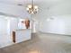 Spacious living room with an open design, connecting seamlessly to the kitchen and entryway at 9308 Fairway Lakes Ct, Tampa, FL 33647