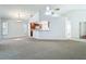 Bright, open living space leads to dining area and kitchen, with ample natural light at 9308 Fairway Lakes Ct, Tampa, FL 33647