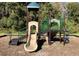 A playground slide and jungle gym offer fun outdoor activities for children to enjoy at 9308 Fairway Lakes Ct, Tampa, FL 33647