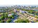An aerial perspective of the condos in a tree-filled neighborhood near a city, showing off the location at 98 W Davis Blvd, Tampa, FL 33606