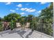 Outdoor balcony view with trees and seating under blue sky at 98 W Davis Blvd, Tampa, FL 33606