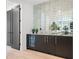 Wet bar with mirrored backsplash, granite countertops and a wine cooler at 98 W Davis Blvd, Tampa, FL 33606