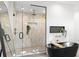 Elegant bathroom showcasing a glass enclosed shower, modern fixtures, and a black soaking tub at 98 W Davis Blvd, Tampa, FL 33606