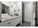 Modern bathroom featuring a marble countertop vanity and a glass-enclosed shower at 98 W Davis Blvd, Tampa, FL 33606