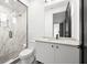 Modern bathroom with a marble shower and white vanity at 98 W Davis Blvd, Tampa, FL 33606