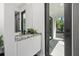 Bathroom with white marble vanity, modern fixtures, and a private balcony at 98 W Davis Blvd, Tampa, FL 33606