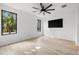 Light and airy bedroom with contemporary ceiling fan and black-framed windows at 98 W Davis Blvd, Tampa, FL 33606