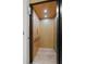 A modern elevator with wood-paneled walls and a light hardwood floor at 98 W Davis Blvd, Tampa, FL 33606