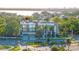 Striking exterior of a modern condo with large windows, clean lines, and lush landscaping in a great neighborhood at 98 W Davis Blvd, Tampa, FL 33606