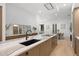Open concept kitchen with island featuring seating, modern countertops, and plenty of cabinets at 98 W Davis Blvd, Tampa, FL 33606